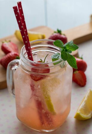 fresh cold strawberry juice on maison jar with ice and mint summer drink close upの写真素材
