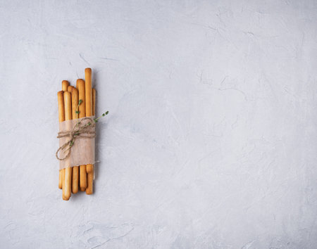 italian stick bread grissini traditional  on gray beton top view