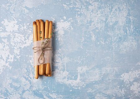 italian stick bread grissini traditional top view blue table copy space pureの写真素材
