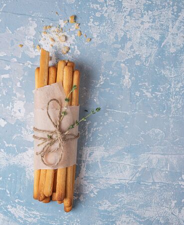 italian stick bread grissini traditional top view blue table copy space pureの写真素材