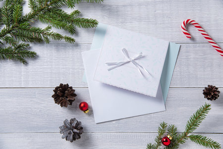 christmas flat lay with letter present  on light wooden table. Christmas background with tree,...