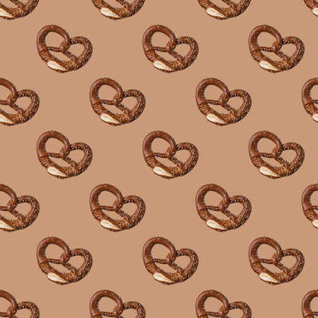 fresh bakery pretzels seamless pattern on brown background. Concept food, top viewの写真素材