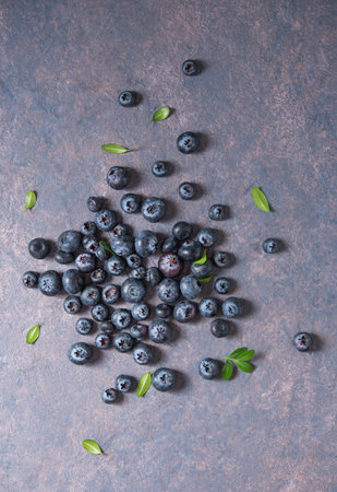 sweet fresh blueberries on dark concrete background. Top view and copy space imageの写真素材