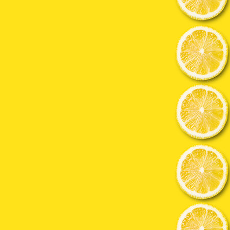 fresh sliced lemon pattern on yellow background. Top view and copy space. Colorful concept healthy and vegan image.の写真素材
