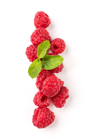 Juicy forest raspberry with mint leaf on a white isolated background. Healthy food concept. Top viewの写真素材