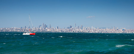 Panoramic view from the sea to Istanbul. The yacht is sailing on the waves in the Sea of Marmara summer sunny day. Turkeyの写真素材