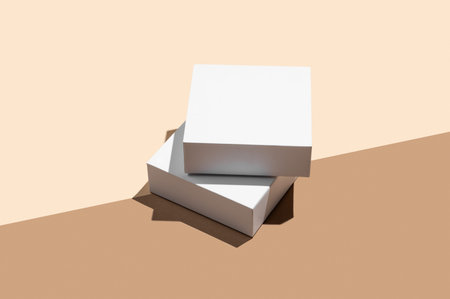 Two white podium or boxes with shadow on diagonally divided yellow and brown background. Concept...