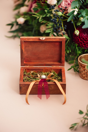 Wedding rings in wooden vintage Rustic style. Selective focus.の写真素材