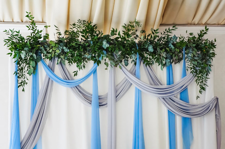 Wedding boutonniere flower roses and blue delphinium white ribbon close upの写真素材
