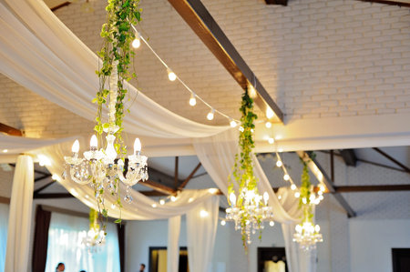 Ceiling Decor with tulle and eclectic chandeliersの写真素材