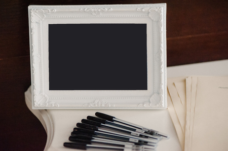 Small greeting image in frame, with cute slogan. Image in black and peachy coloursの写真素材