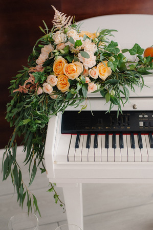 Royal wedding ceremony with piano decorated by flowers and candlesの写真素材