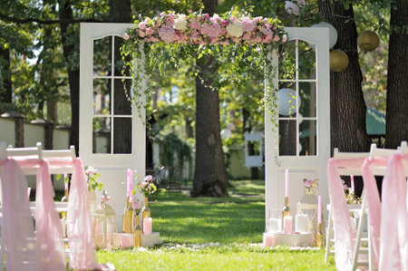 Beautiful wedding arch, decorated with roses and peons, closeupの写真素材