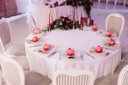 Beautifully decorated guest table, with guests names on pomegranateの写真素材