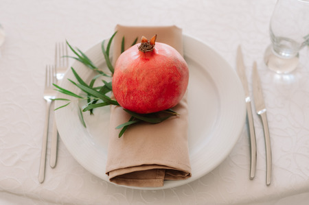Beautifully decorated with pomergranate table sittingの写真素材