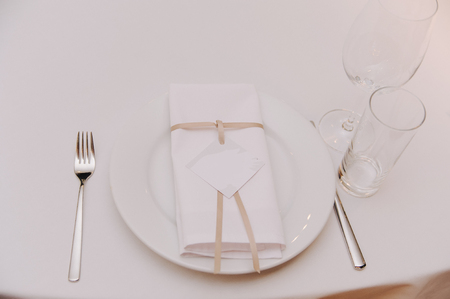 Decorated with bow and lable napkin on settingの写真素材