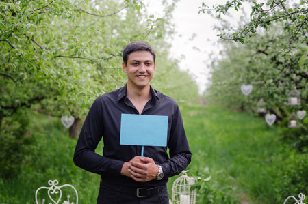 Love story in photos. Portrait of man in black suitの写真素材
