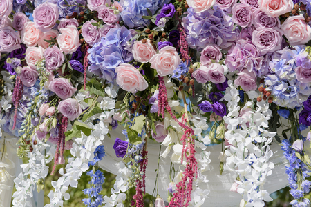 Floral decoration with violet, blue, pink and white flowers for the weddingの写真素材