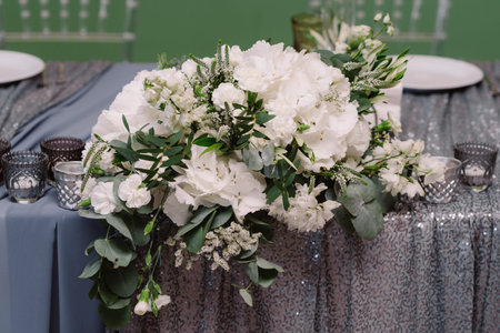 White floral decoration of the table for the wedding ceremonyの写真素材