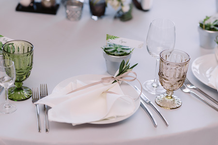 Wedding tableware, napkin with tender ribbon on the plateの写真素材