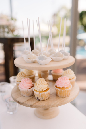 Sweet products at a wedding. Beautiful tasty cookies and cakes on glasswaresの写真素材