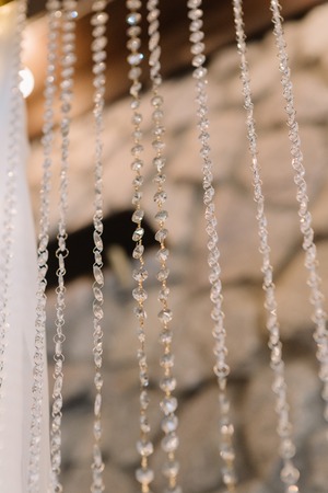 Transparent crystals in a wedding decor. Details of a festive interior.の写真素材