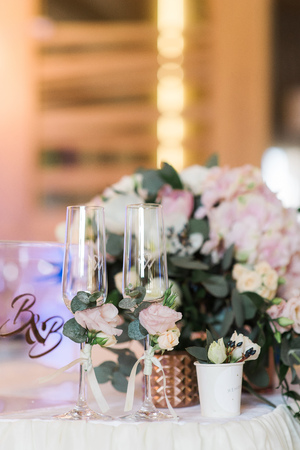 Lunch table for guests at a wedding. Fresh flowers in a vase on a tableの写真素材