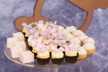 Beautiful wedding candy bar. Sweet products at a wedding. Beautiful tasty cookies and cakes on glasswaresの写真素材