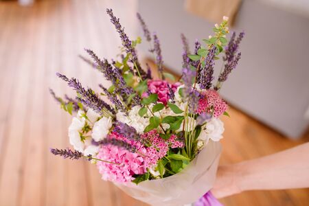 Bouquet of lavender and dry flowers. Colorful summer bunch of purple lavender and pink Hydrangea flowers. Beautiful summer bouquetの写真素材