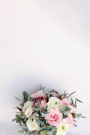 Wedding flowers, bridal bouquet closeup. Decoration made of roses, protea and decorative plants, close-up, selective focus, nobody, objects. Wedding invitation card template, copy spaceの写真素材
