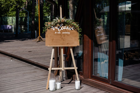 Board, which stands on the grass with wedding inscription. Mockup for invitationの写真素材