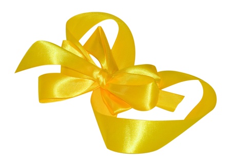 yellow satin ribbon, tied in a bow の写真素材