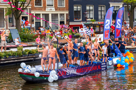 Amsterdam, Netherlands - August 2, 2014: GaySwimAmsterdam boat at the famous Canal Parade of the Amsterdam Gay Pride 2014. Every year the parade is visited by more than 400,000 peopleのeditorial素材