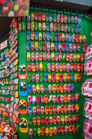 Amsterdam, Netherlands - July 30,2014: Souvenir shop in Amsterdam. Wooden shoes clogs, windmills and tulips - the most popular souvenirs and traditional symbol of Holland.のeditorial素材