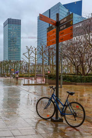 Paris, France - December 19, 2014: Rainy day in business district of Defense.  Defense - Parisian Manhattan, the largest business center in Europe.のeditorial素材