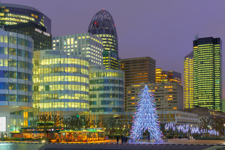 Paris, France - December 19, 2014: Christmas tree among the skyscrapers of La Defense.  Defense - Parisian Manhattan, the largest business center in Europe.のeditorial素材