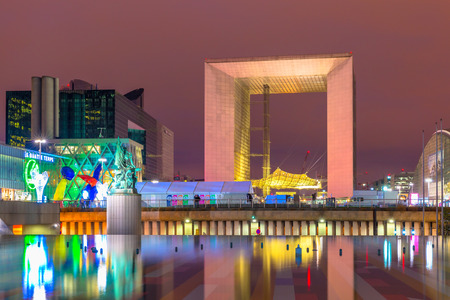 Paris, France - December 21, 2014:  Illuminated Grand Arch in business district La Defense at night Paris, France. Grande Arche is a 20th-century version of the Arc de Triomphe, a monument to humanity than military victories.のeditorial素材
