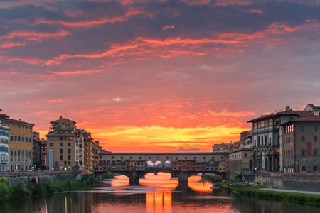 River Arno and famous bridge Ponte Vecchio at sunset from Ponte alle Grazie in Florence, Tuscany, Italyの写真素材