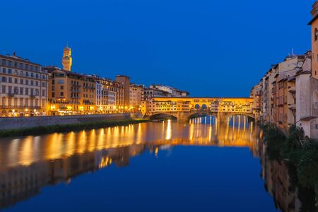 Arno and Ponte Vecchio at night Florence Italyの写真素材