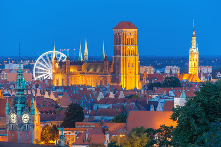 Aerial view of the Saint Mary Church and City Hall at night in Gdansk, Poland