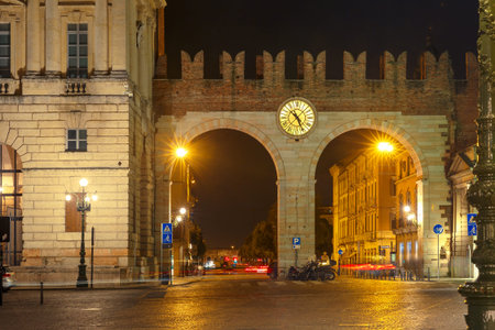Medieval city gate Portoni della Bra at night in Verona, Northern Italy.の写真素材