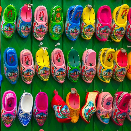 Amsterdam, Netherlands - July 30,2014: Dutch souvenirs clogs - box for shoe brush on the counter in the Souvenir shop in Amsterdam. Wooden shoes clogs, windmills and tulips - the most popular souvenirs and traditional symbol of Holland.のeditorial素材