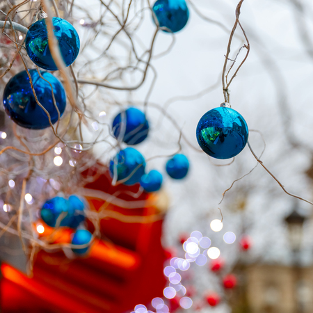 Blue shiny balls on Christmas decorated street in Paris, Franceの写真素材