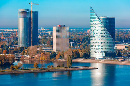 Aerial view of River Daugava and modern business financial skycrapers from Saint Peter church, Riga,...