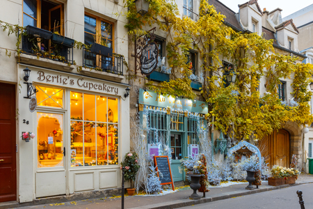 Paris, France - December 19, 2015: Typical Parisian cafes decorated for Christmas in the heart of Paris. Christmas is one of the main Catholic holidays, which is celebrated on a large scale throughout Europe.のeditorial素材