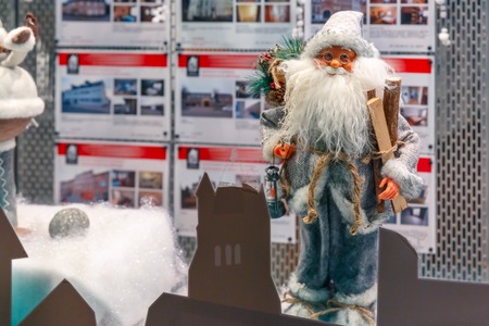 Santa Claus and Christmas tree at shop window in Bruges, Belgiumの写真素材