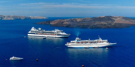 Cruise ships, caldera and volcano near Fira, modern capital of the Greek Aegean island, Santorini, Greece. Panoramaの写真素材