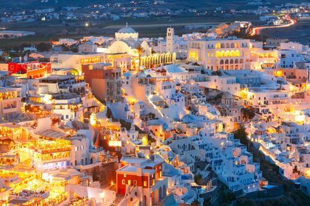Fira, modern capital of the Greek Aegean island, Santorini, with Orthodox Metropolitan Cathedral at night, Greeceの写真素材