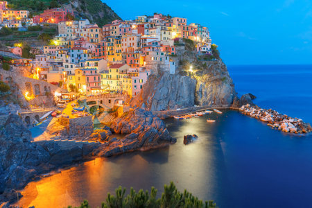 Aerial night view of Manarola fishing village, seascape in Five lands, Cinque Terre National Park,...