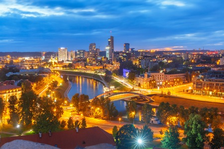 Aerial panoramic cityscape with skyscrapers of New Center of Vilnius from Gediminas Tower at night, Lithuania, Baltic states.の写真素材